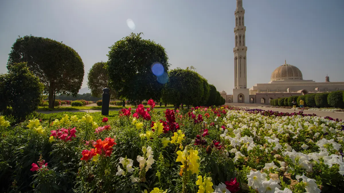 Sultan Qaboos Grand Mosque in Muscat, with a flower garden in front